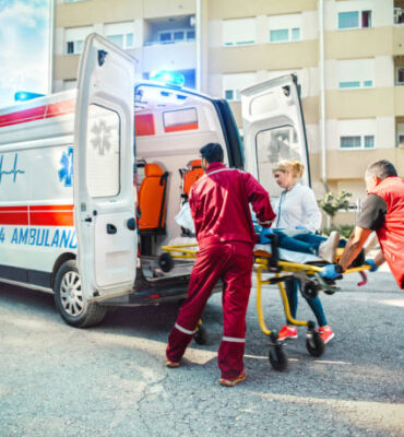 Medical emergency team helping injured woman